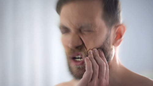 Sharp-Toothache-Disturbing-Man