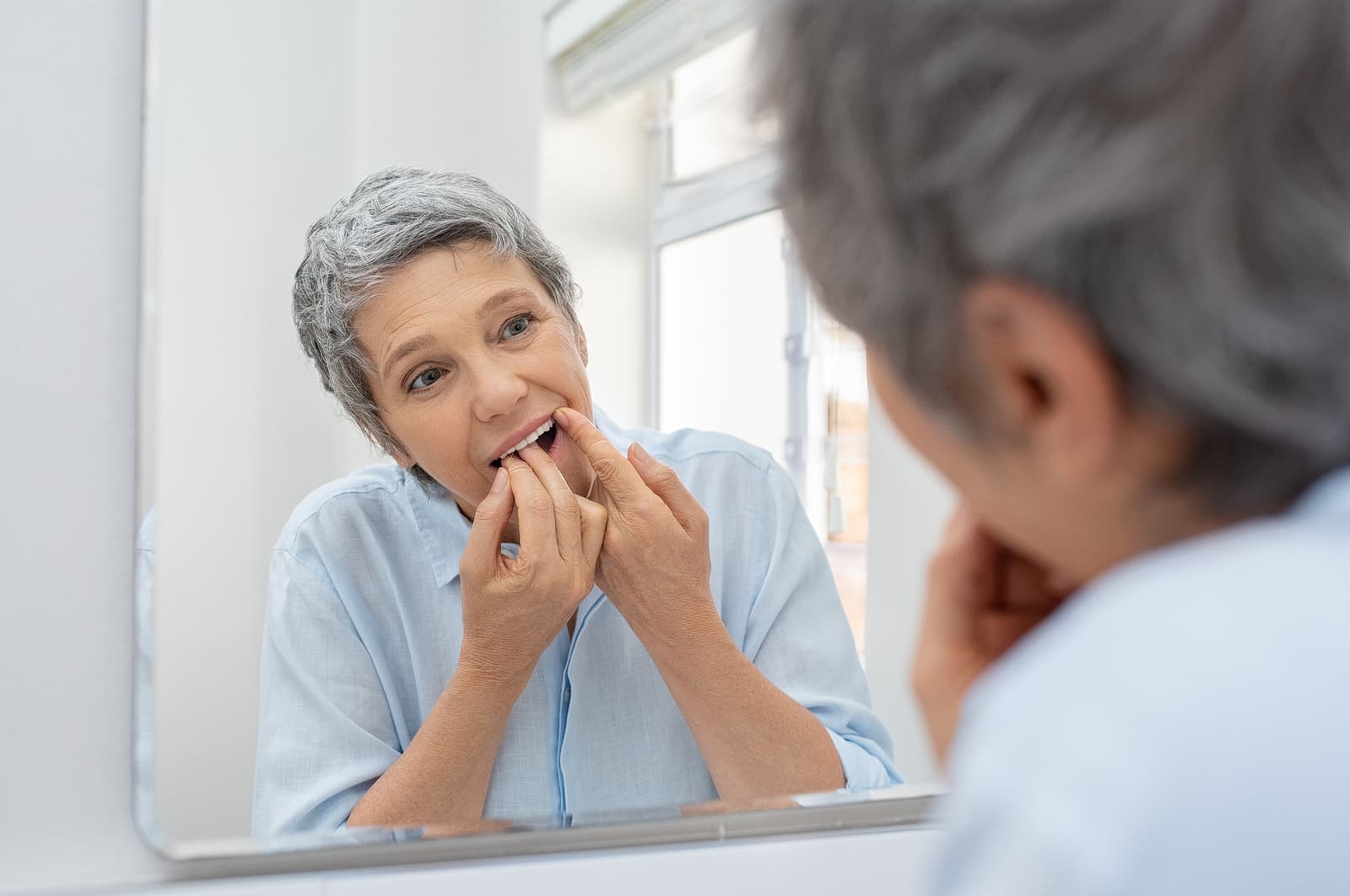 mature-woman-flossing