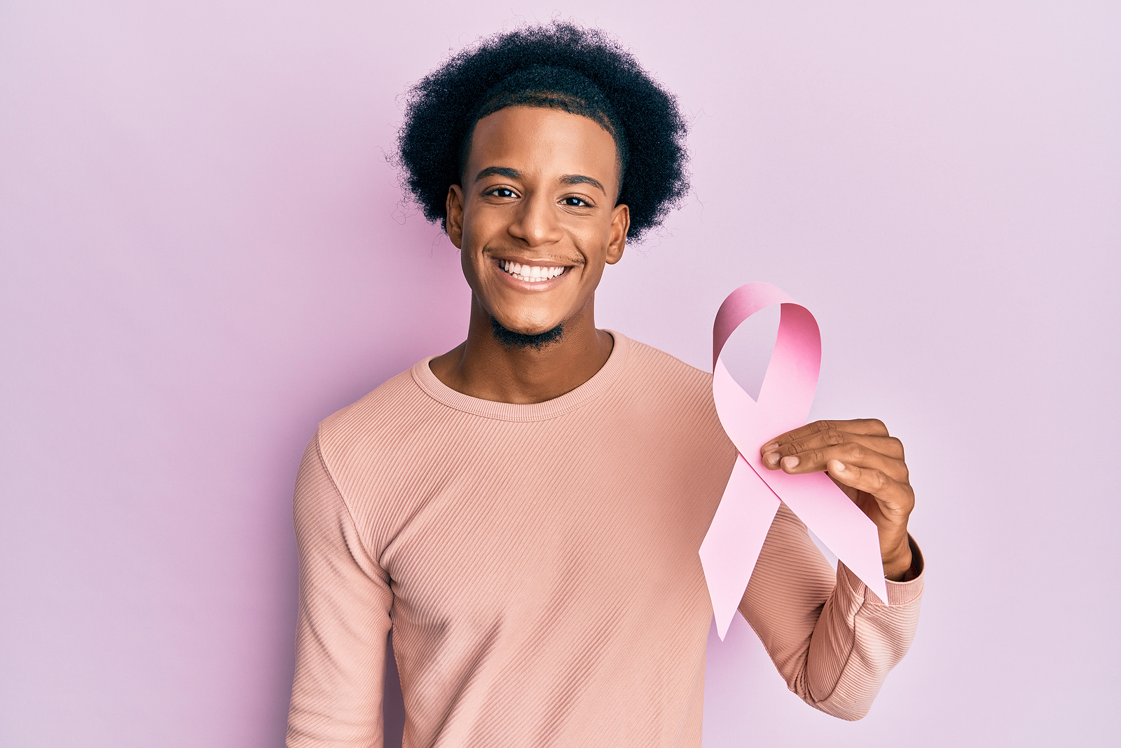 Man-Holding-Pink-Cancer-Ribbon